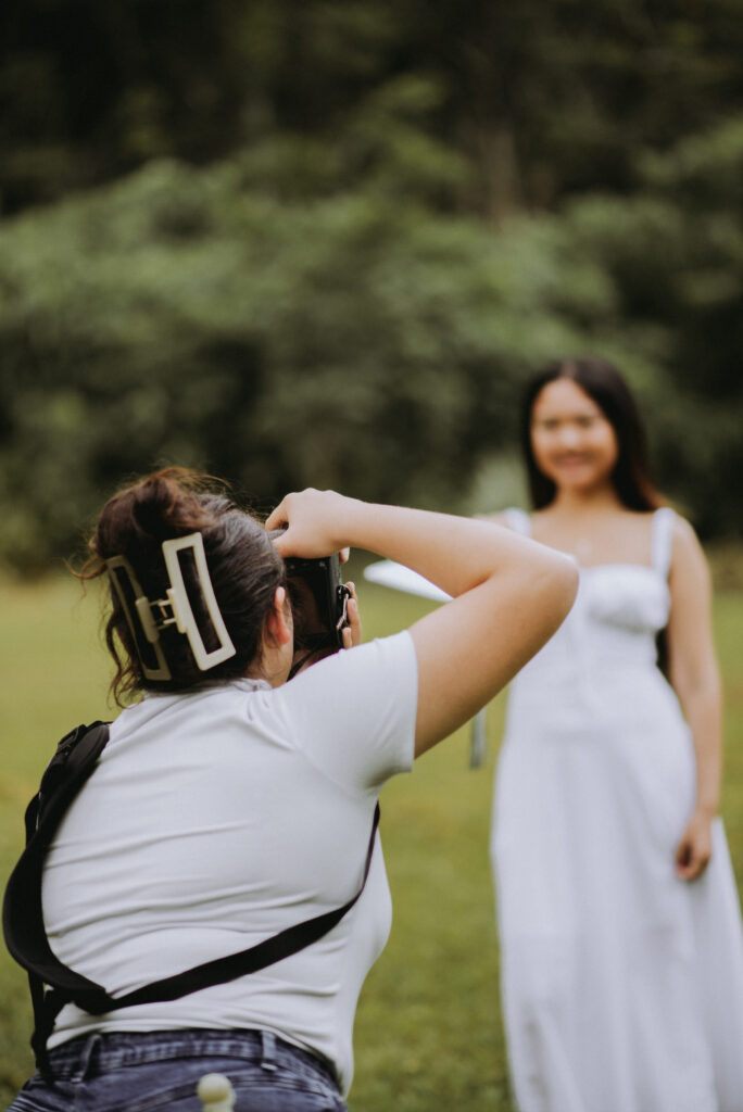 Kadi capturing a portrait during a session as part of her photography mentorship journey.