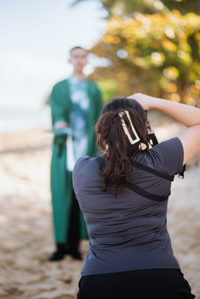 Candid moment of Kadi in action, gaining experience through photography mentorship.
